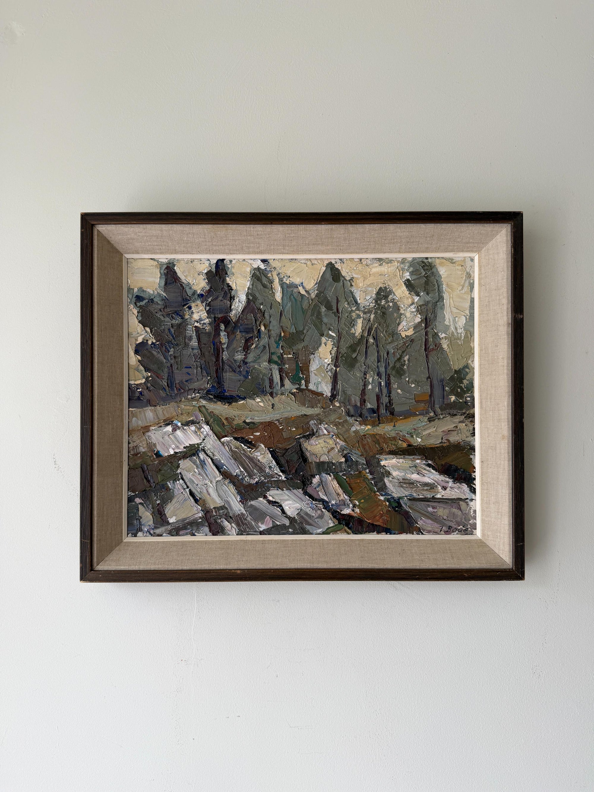Framed vintage oil artwork of a landscape with forest trees and rocks. Available at Hue.