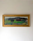 Framed vintage landscape oil painting of a landscape with fields and mountains. Available at Hue