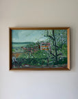 Framed vintage oil painting of a landscape with trees and buildings. Available at Hue.