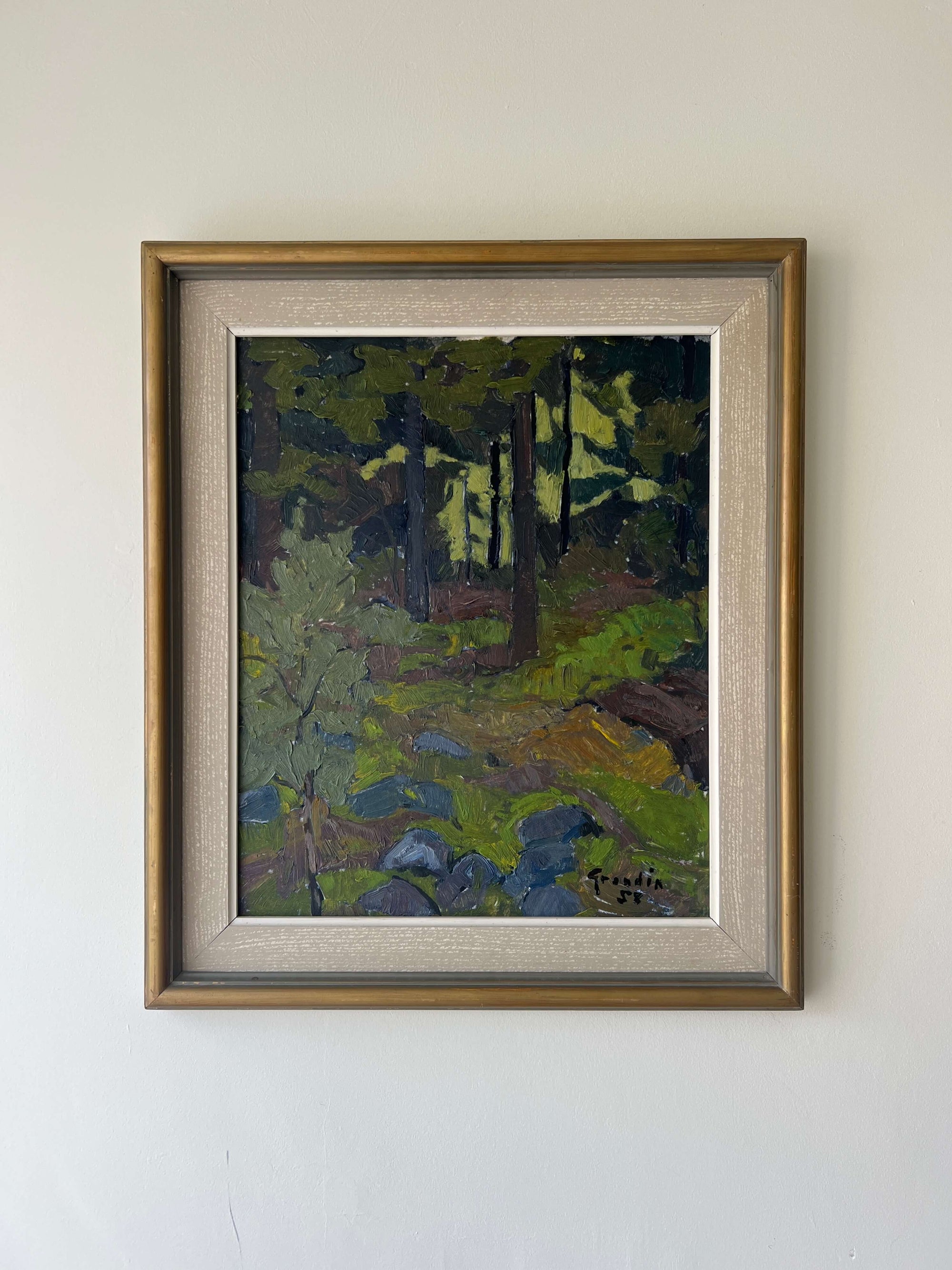 Framed vintage oil painting of a dense forest scene in a vintage wooden frame with linen mount, available at Hue.