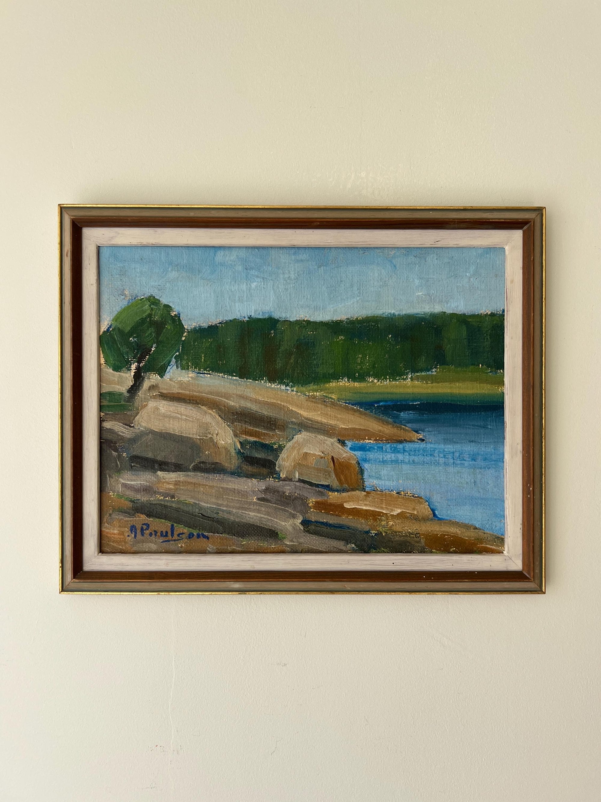 Framed vintage oil painting of a landscape with rocks and water in a  vintage frame, available at Hue.