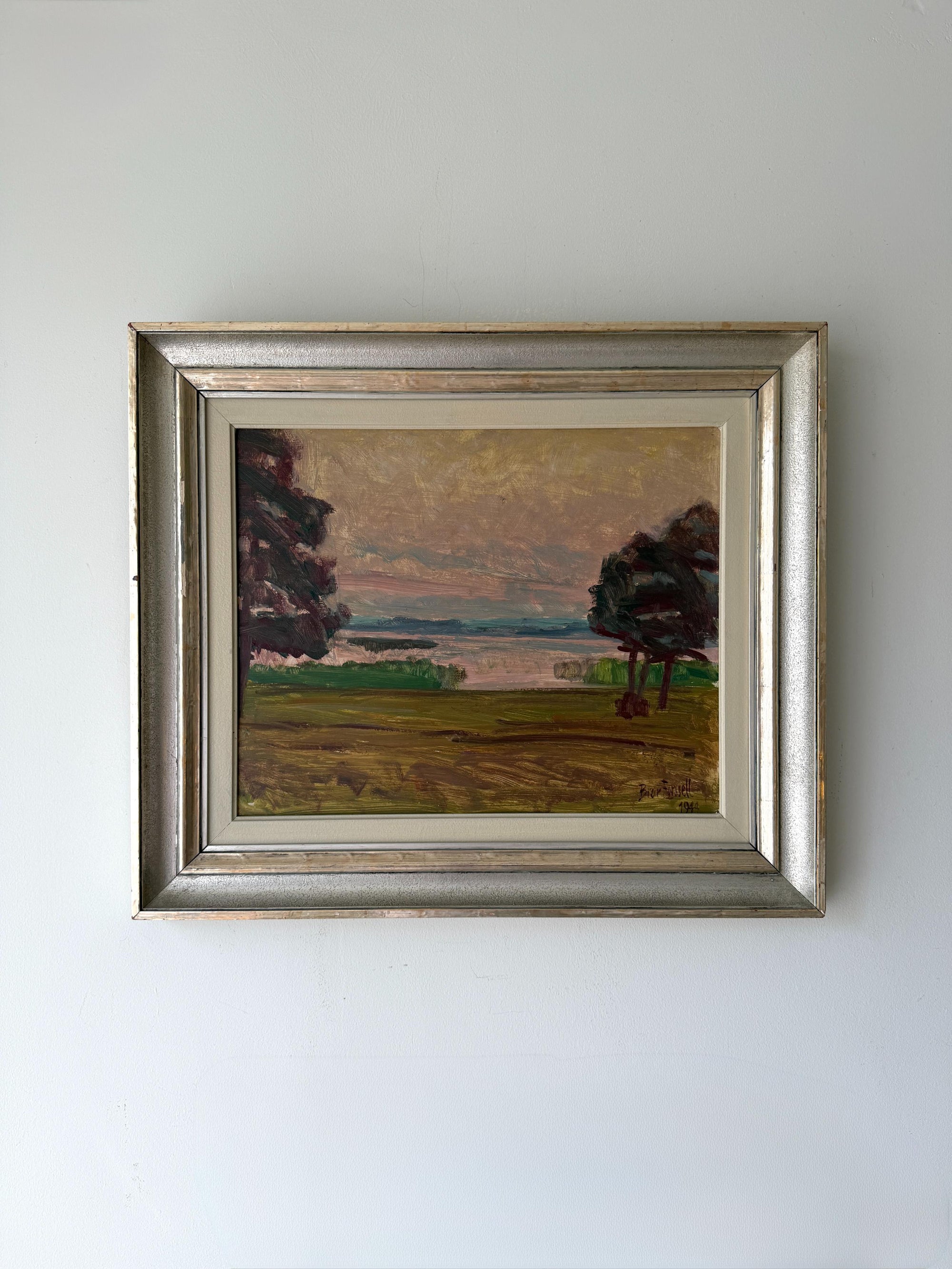 Framed vintage oil painting of a landscape with trees and an evening sky. Available at Hue. 