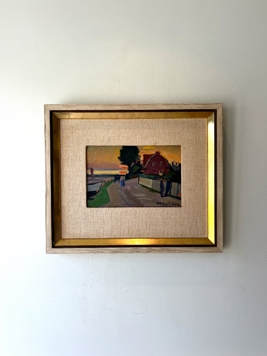 Framed vintage oil painting of a coastal harbour scene with a red building. Available at Hue. 