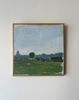 Framed vintage oil painting of a landscape with green pastures, hills on the horizon and blue sky. Available at Hue. 