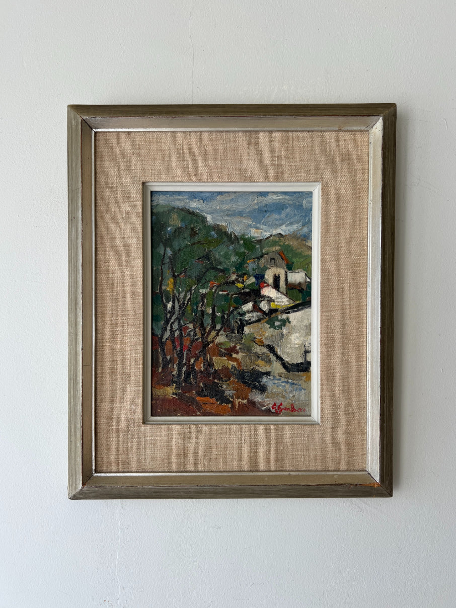 Framed vintage oil painting of a rural hillside village among trees. Available at Hue. 