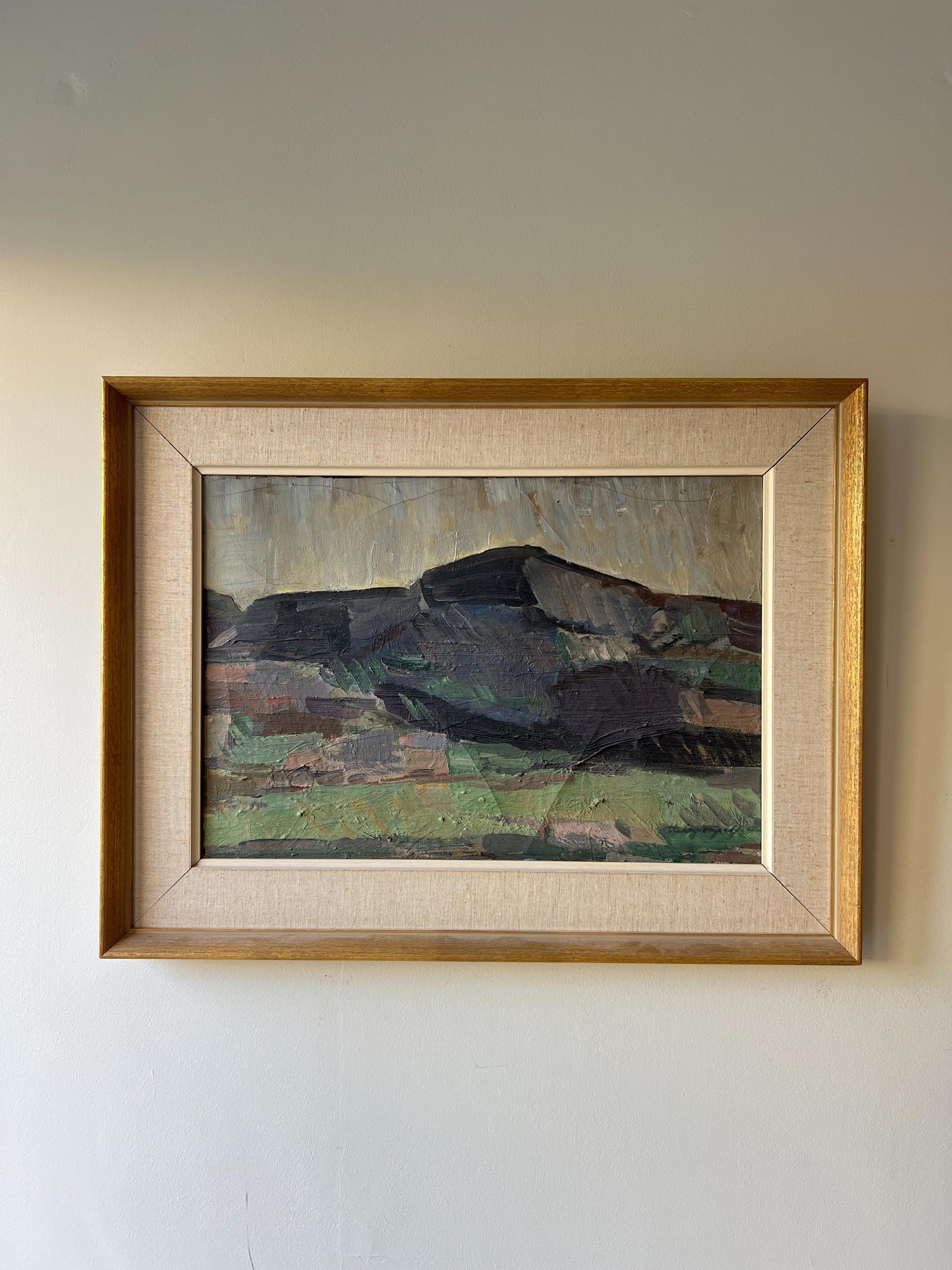 Framed vintage oil painting of a mountainous landscape with a gold gilt frame, available at Hue.
