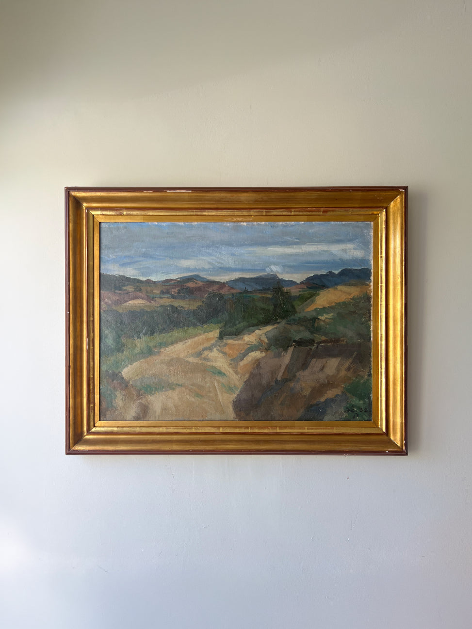 Framed vintage landscape oil painting of a French mountain scene. Available at Hue. 