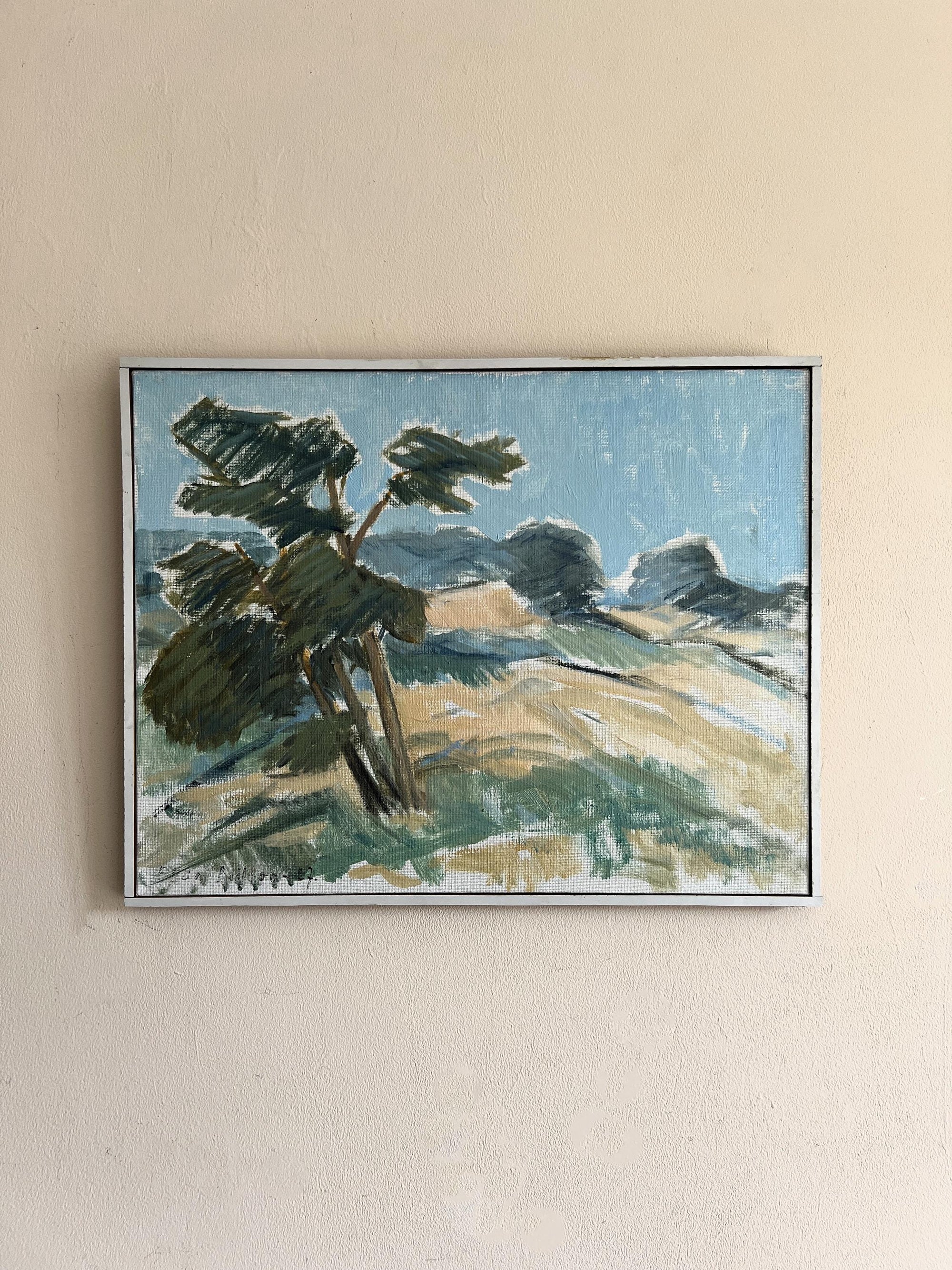 Framed vintage painting of a landscape with trees and mountains, available at Hue.