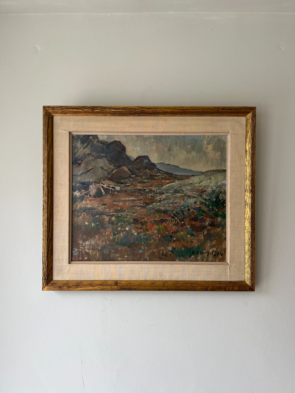 Framed vintage oil painting of a rocky mountain landscape. Available at Hue. 