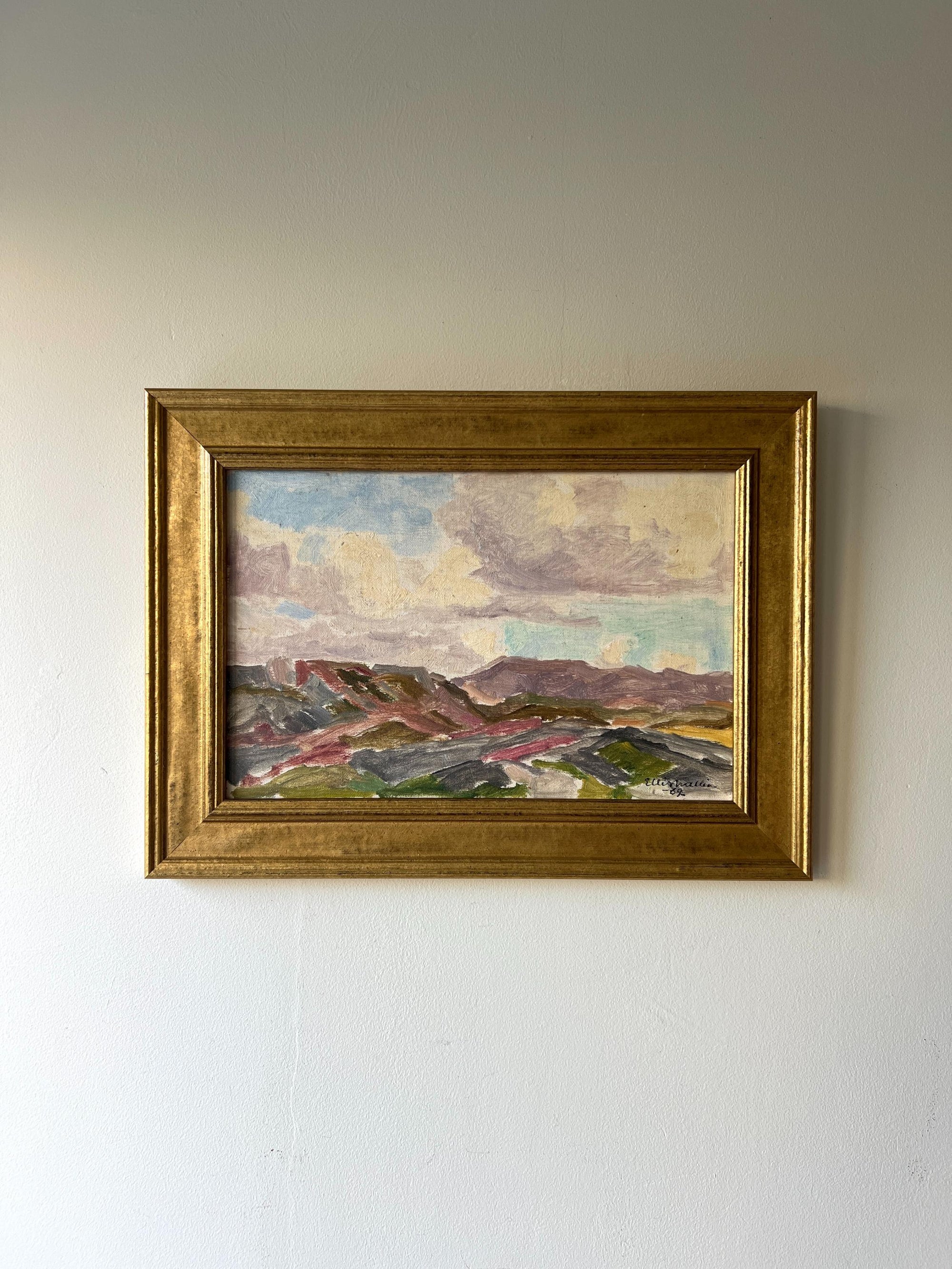Framed vintage oil painting of a mountainous landscape with lilac and green colours, available at Hue.