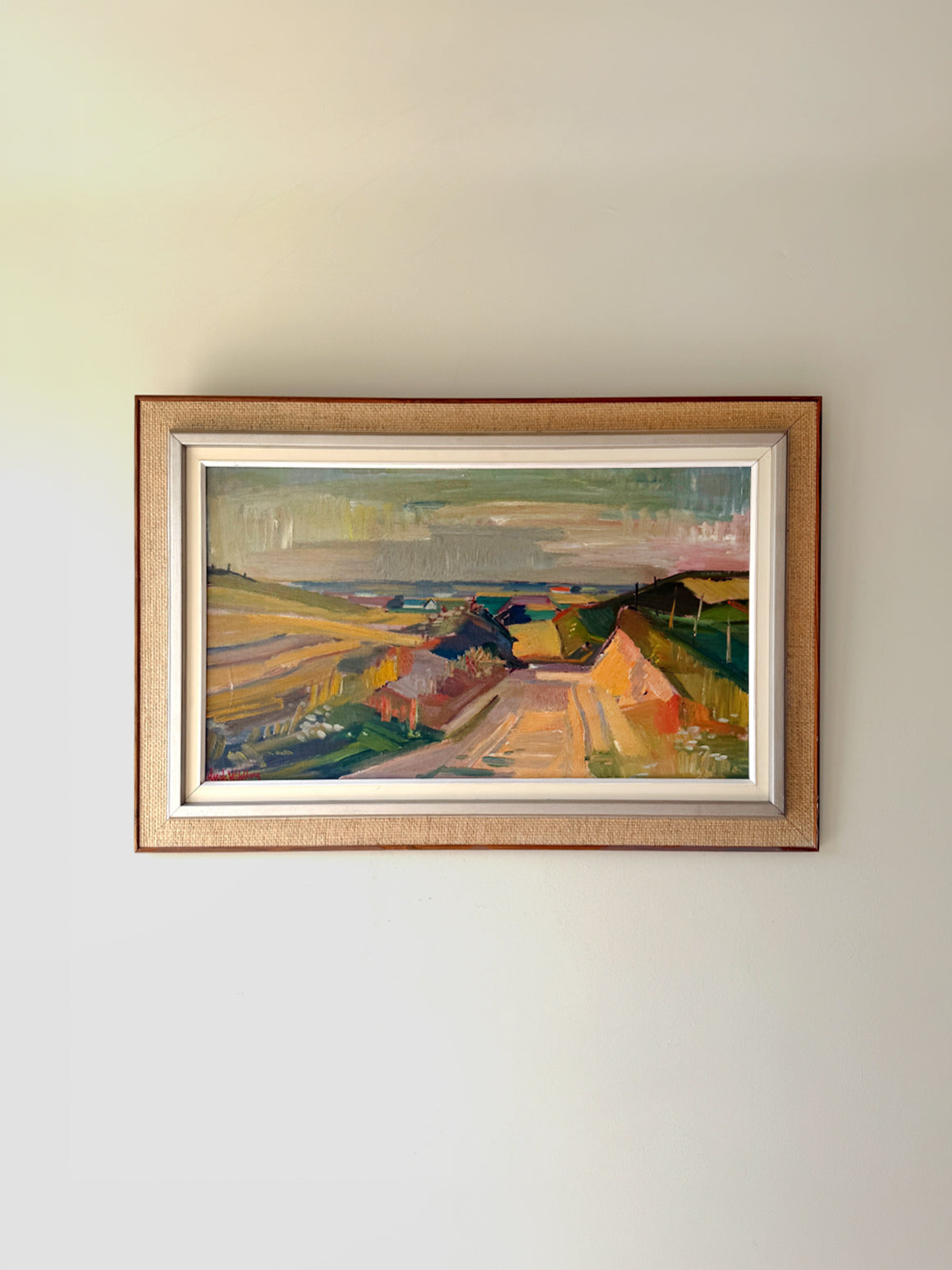 Framed vintage landscape oil painting of a farmland view. Available at Hue.