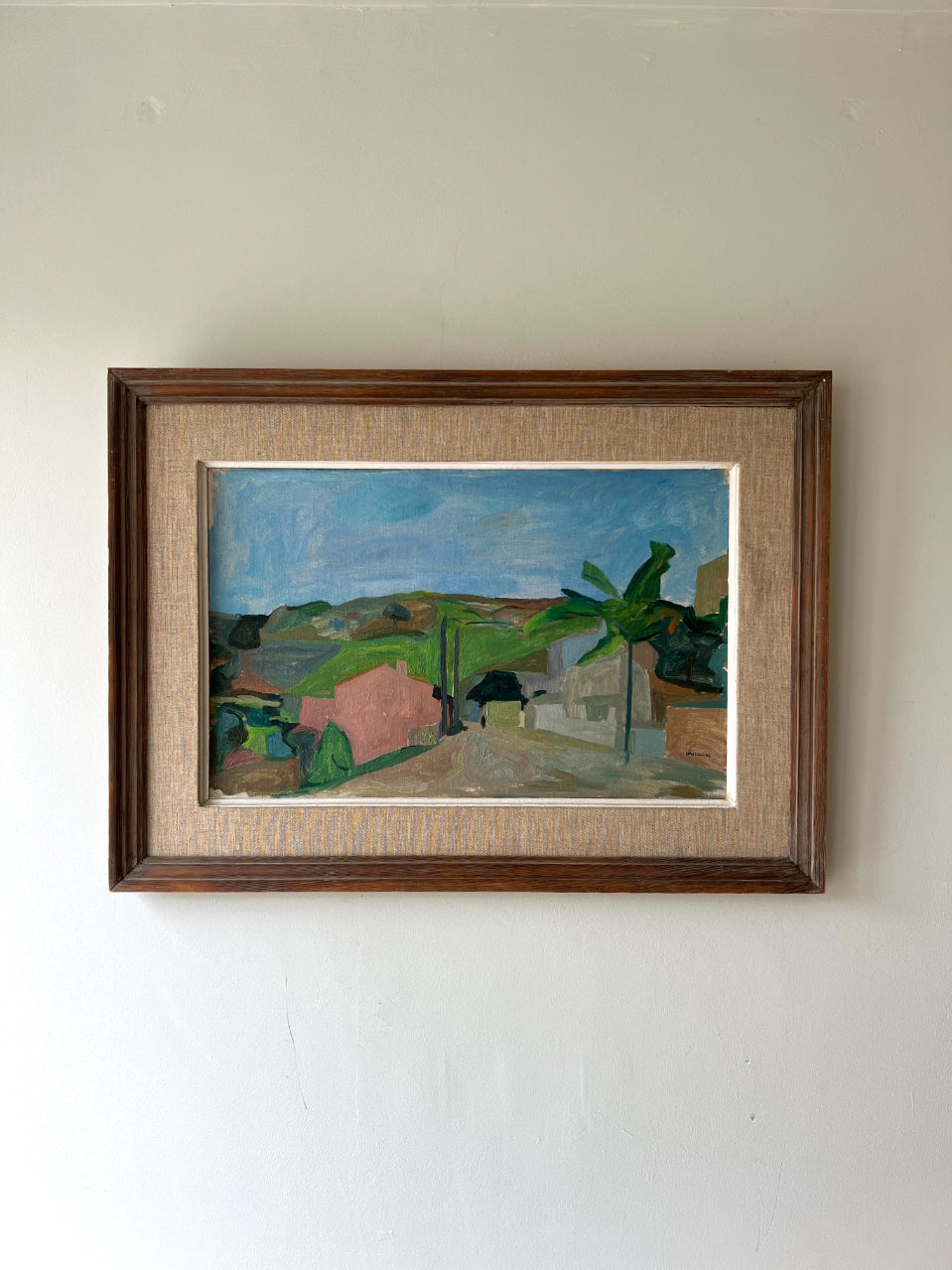 Large framed vintage oil painting of a landscape with tropical greenery. Available at Hue. 