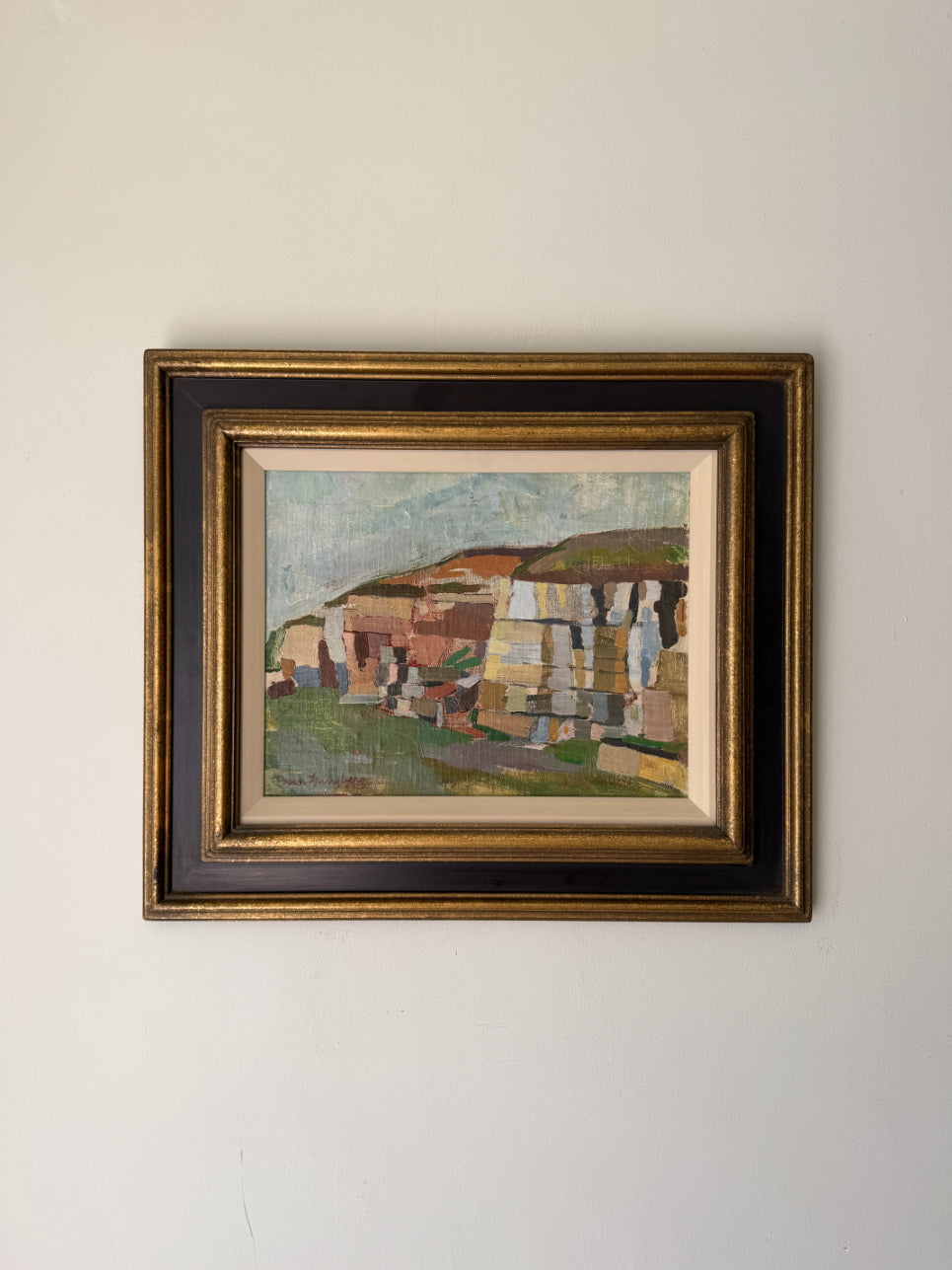 Framed vintage oil painting of a colourful landscape. Available at Hue. 
