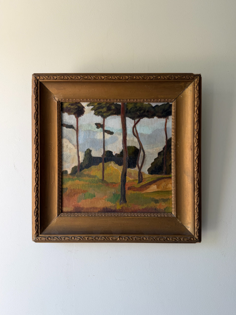 Framed vintage oil painting of a landscape with pine trees. Available at Hue. 