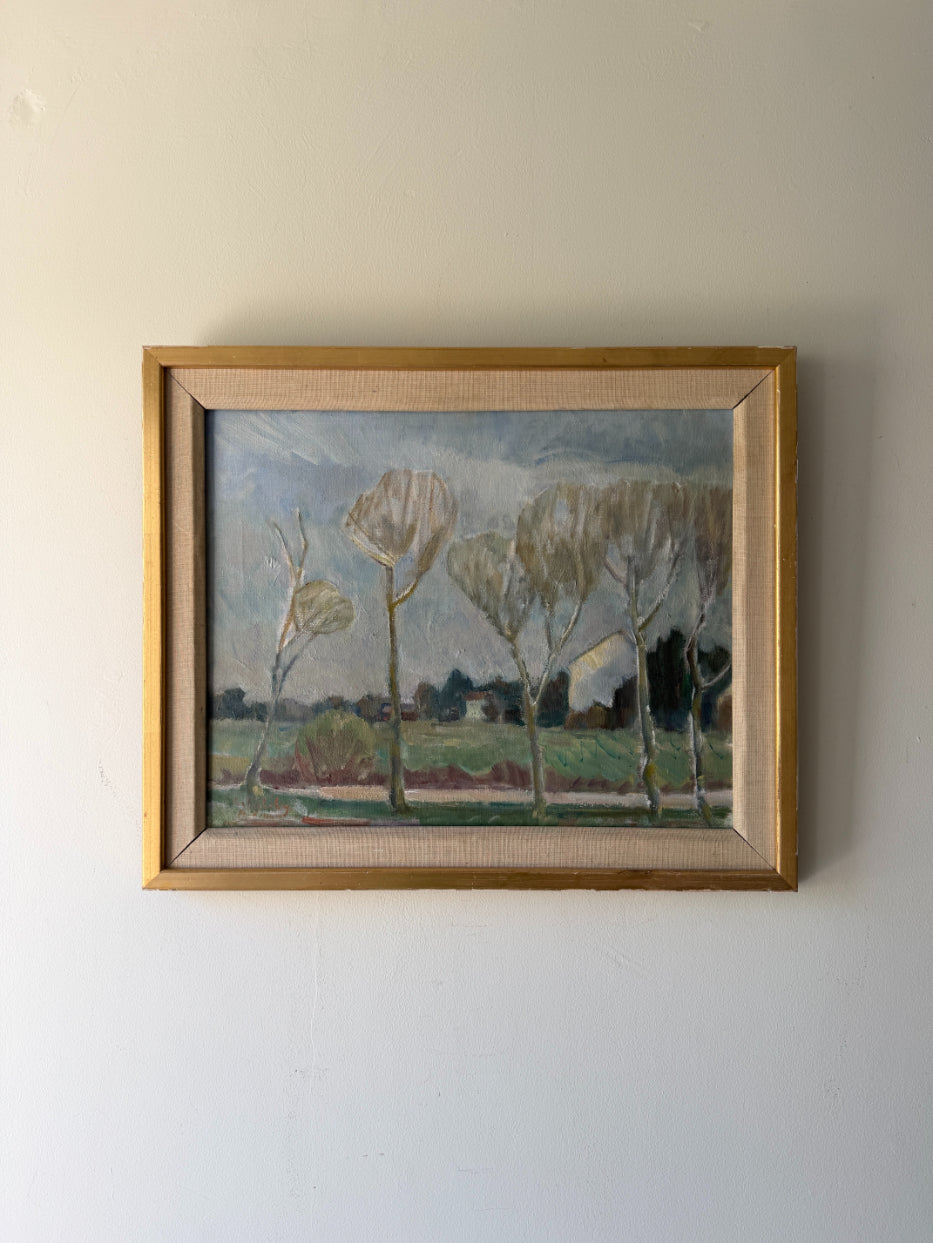 Framed vintage landscape oil painting of trees in the countryside. Available at Hue. 
