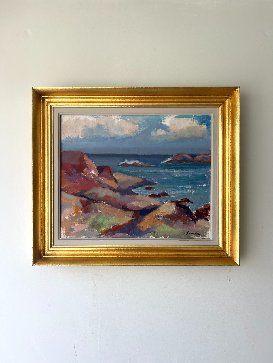 Framed vintage oil painting of a coastal scene with rocky shore. Available at hue. 