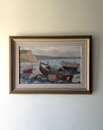 Framed vintage oil painting of boats on a dock. Available at Hue. 