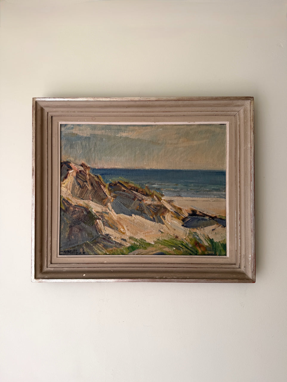 Framed vintage oil painting of a coastal landscape. Available at Hue. 