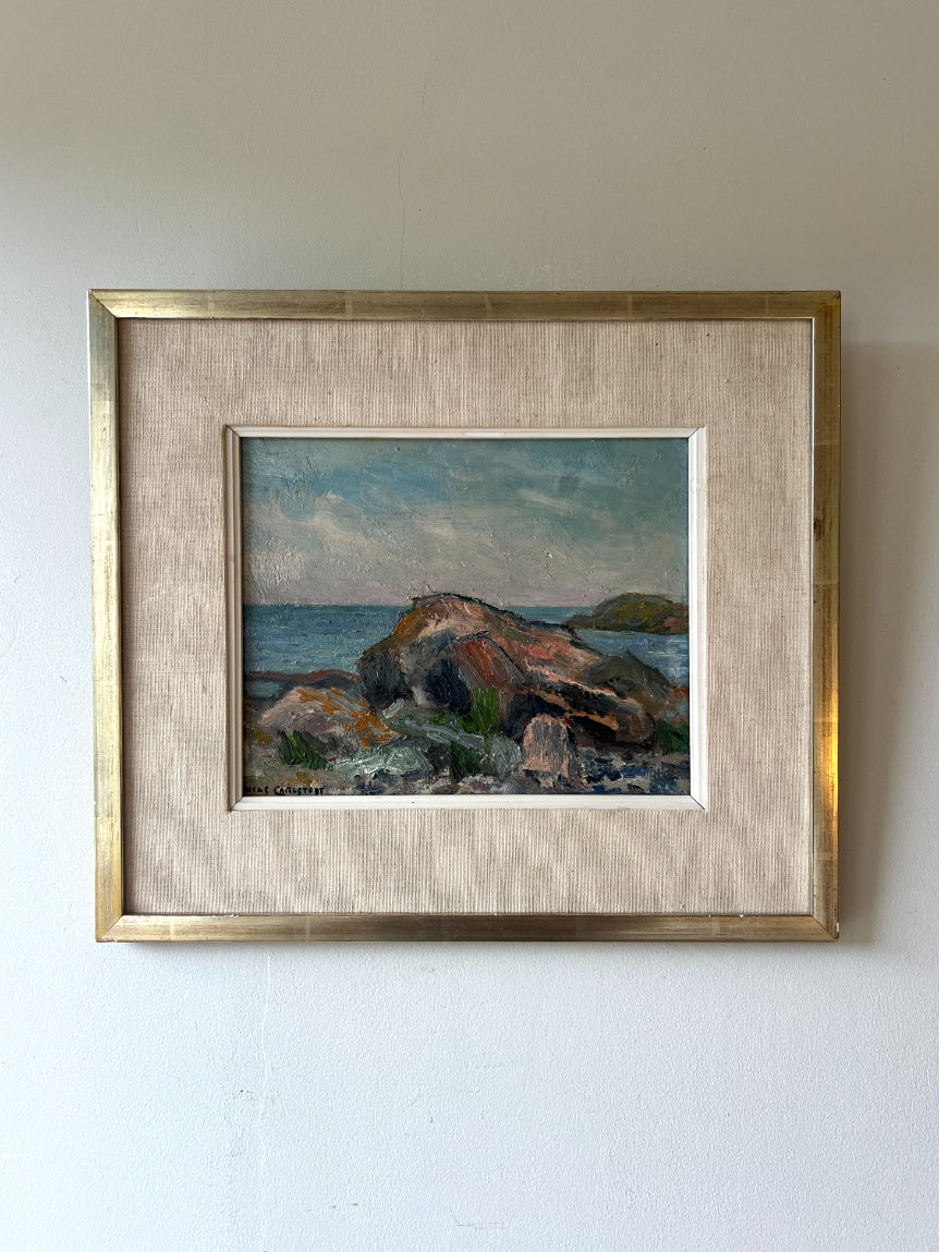Framed vinatge oil painting of a coastal scene with rocks and water. Available at Hue. 