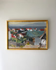 Framed vintage oil painting of a coastal village scene. Available at Hue.