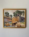 A framed vintage landscape painting depicting sheep and goats grazing near a stone wall and trees. Available at Hue. 