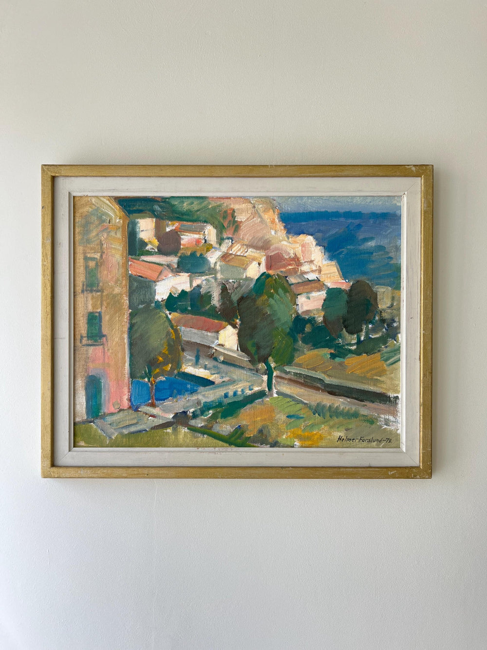 Framed vintage oil painting of a hillside  village scene, available at Hue
