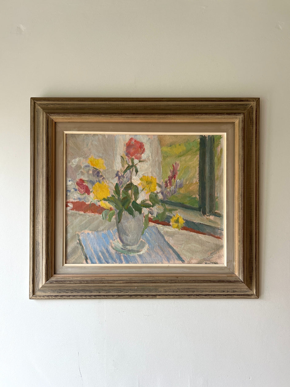 Framed vintage oil painting of a still life with flowers on a table beside a window. Available at Hue. 