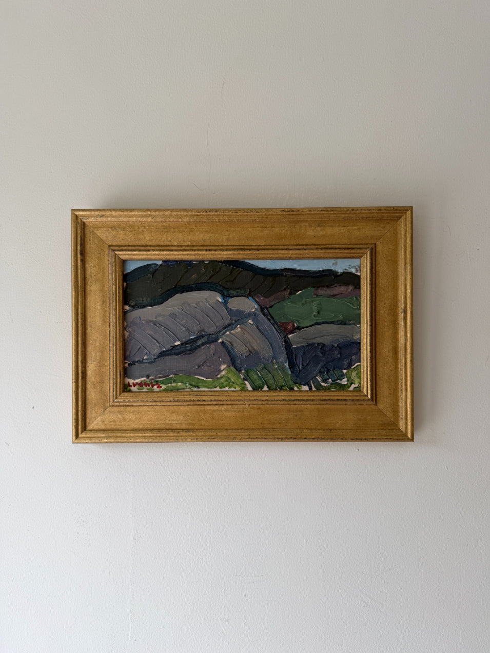 Small framed vintage landscape oil painting of a rocky terrain. Available at Hue. 