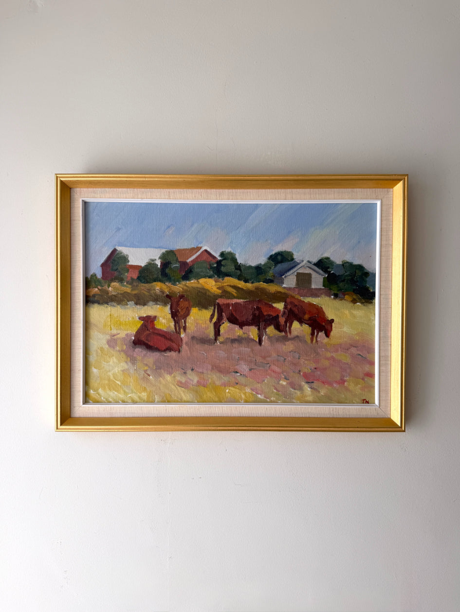 Framed vintage oil painting of cows in a field. Available at Hue. 