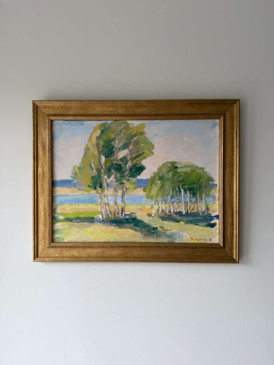 Framed vintage oil painting of birch trees by a lake. Available at Hue.