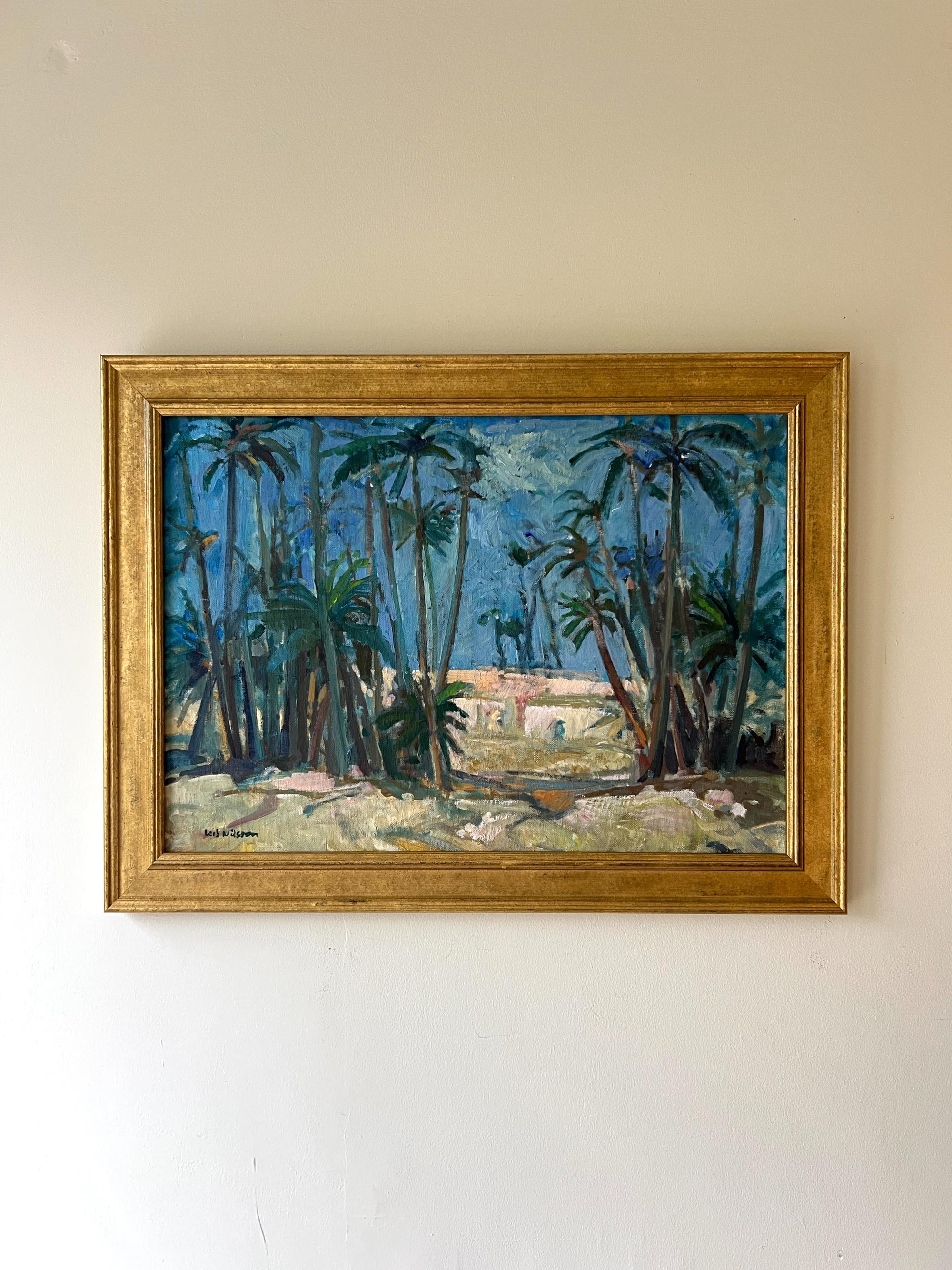 Framed vintage oil painting of a tropical landscape with palm trees, available at Hue.