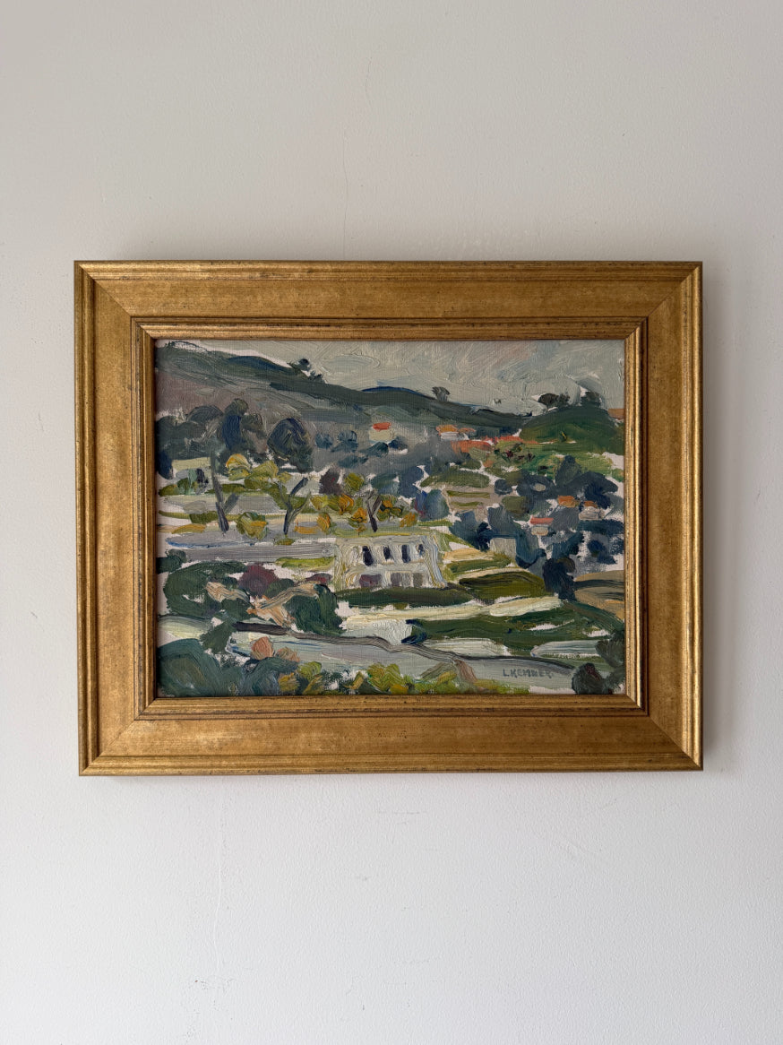 Framed vintage oil painting of a landscape with a houses on a hillside. Available at Hue.