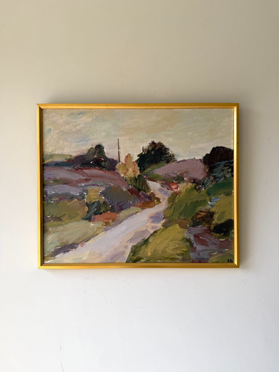 Framed vintage landscape painting of a rural lane. Available at Hue. 