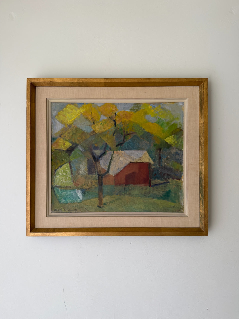 Framed vintage oil painting of a landscape with trees and a red building. Available at Hue. 