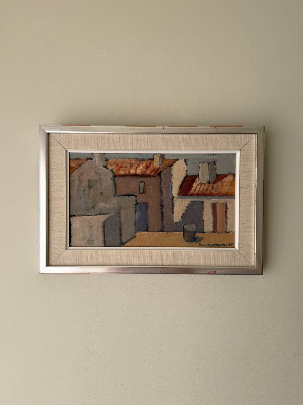 Framed vintage oil painting of a village scene with white, sunlit houses. Available at Hue.