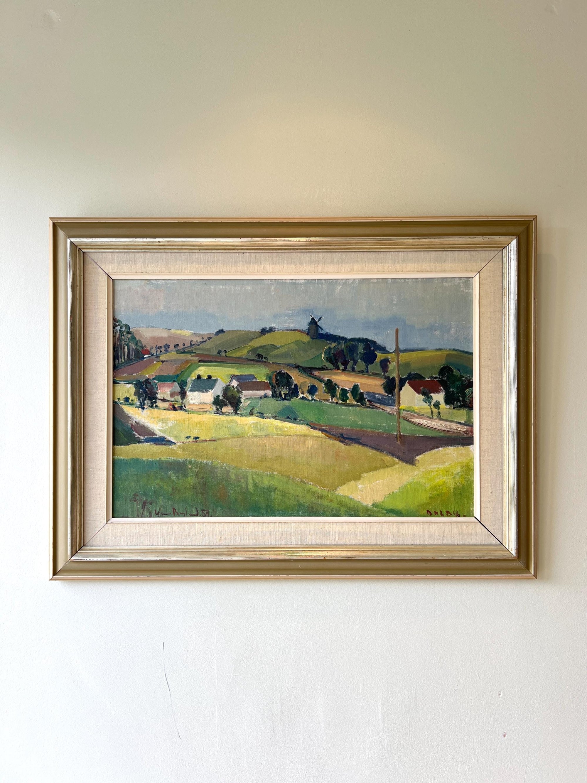 Framed oil painting of a landscape scene with rolling hills and a windmill, available from hue