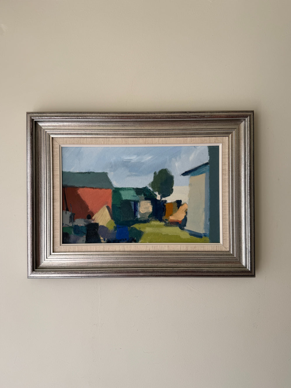 Framed vintage oil painting of a landscape with houses. Available at Hue. 
