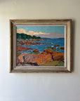 Framed vingtage oil painting of a coastal scene with rocks and water. Available at Hue. 