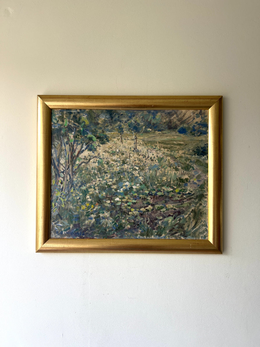 Framed vintage oil painting of wild flowers in a meadow. Available at Hue. 