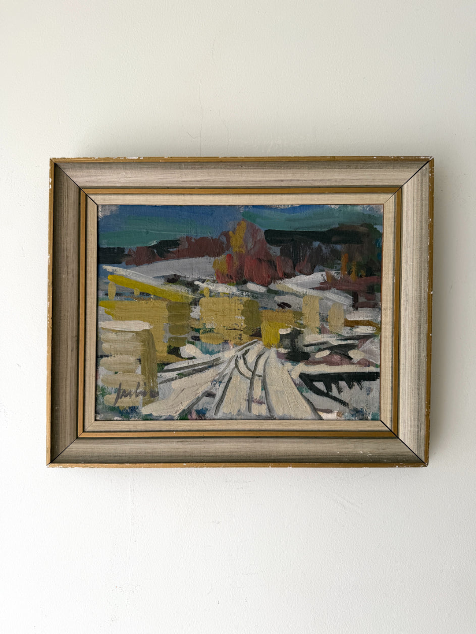 Framed vintage oil painting of a snowy landscape with buildings. Available at Hue. 