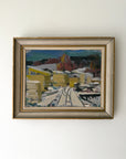 Framed vintage oil painting of a snowy landscape with buildings. Available at Hue. 