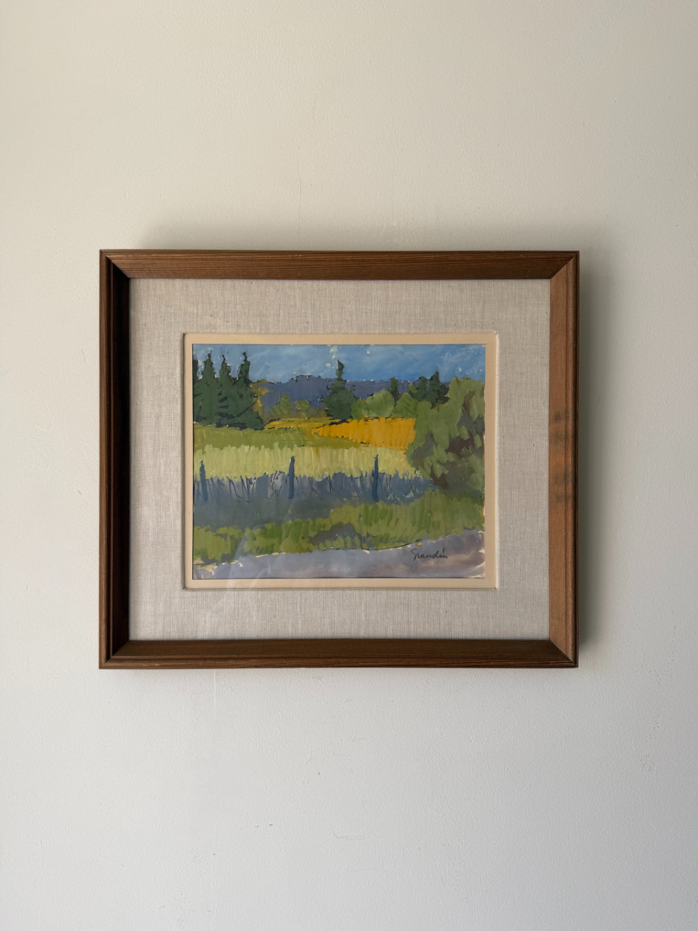 Framed vintage painting of a landscape with trees and fields. Available at Hue. 
