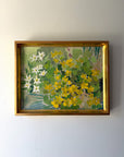 Framed vintage oil painting of yellow flowers. Available at Hue.