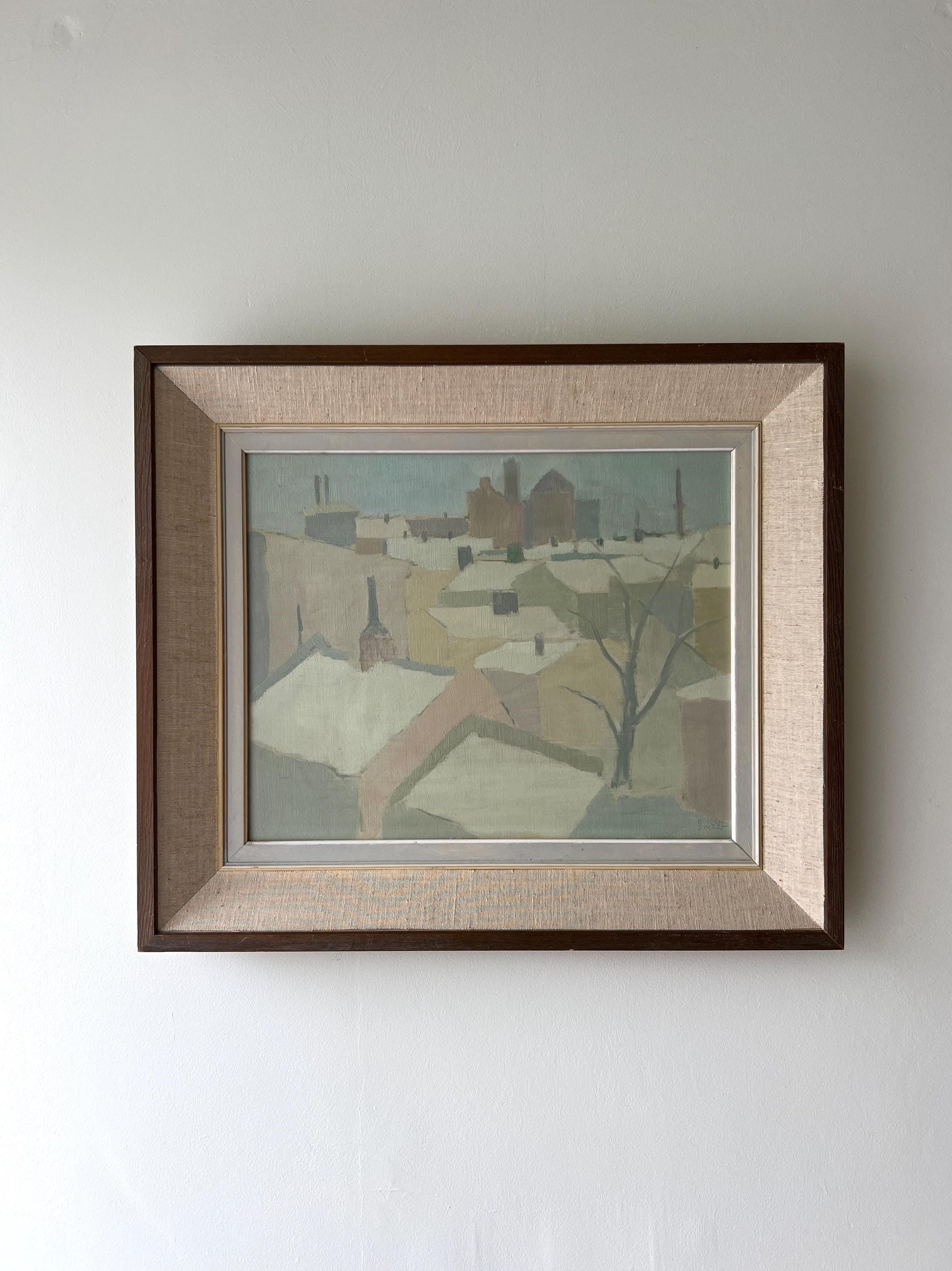 Framed vintage painting of a muted townscape, available at Hue.