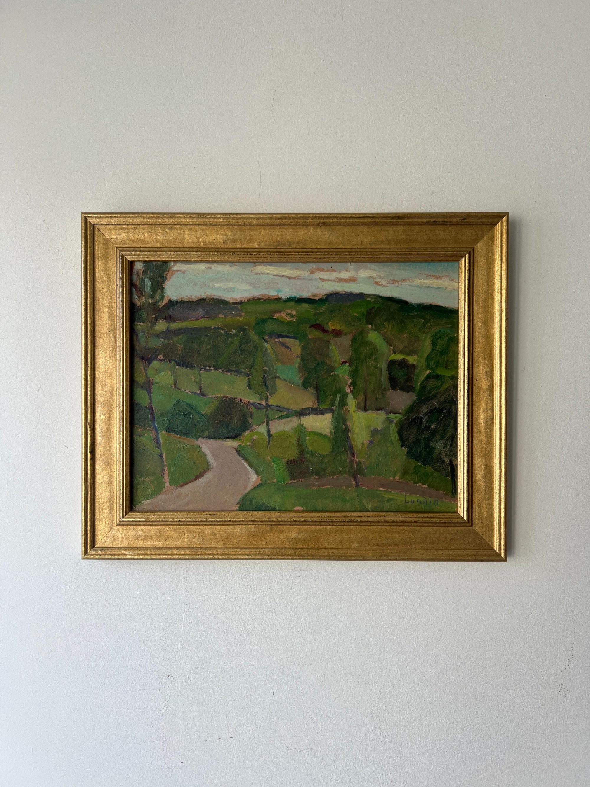 Framed vintage oil painting of a landscape with greenery and a path. Available at Hue.