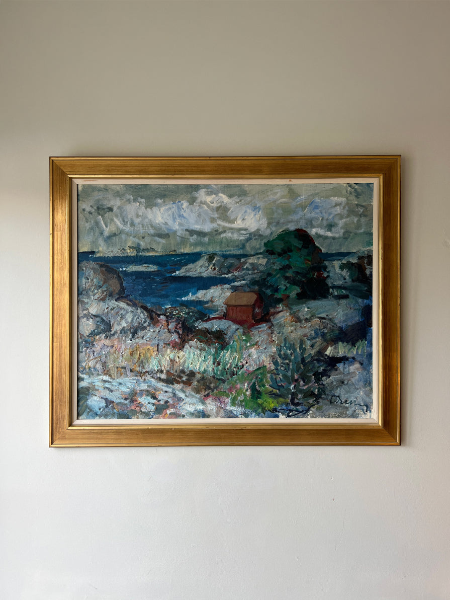Framed vintage oil painting of a landscape with rocks and a red hut. Available at Hue, 
