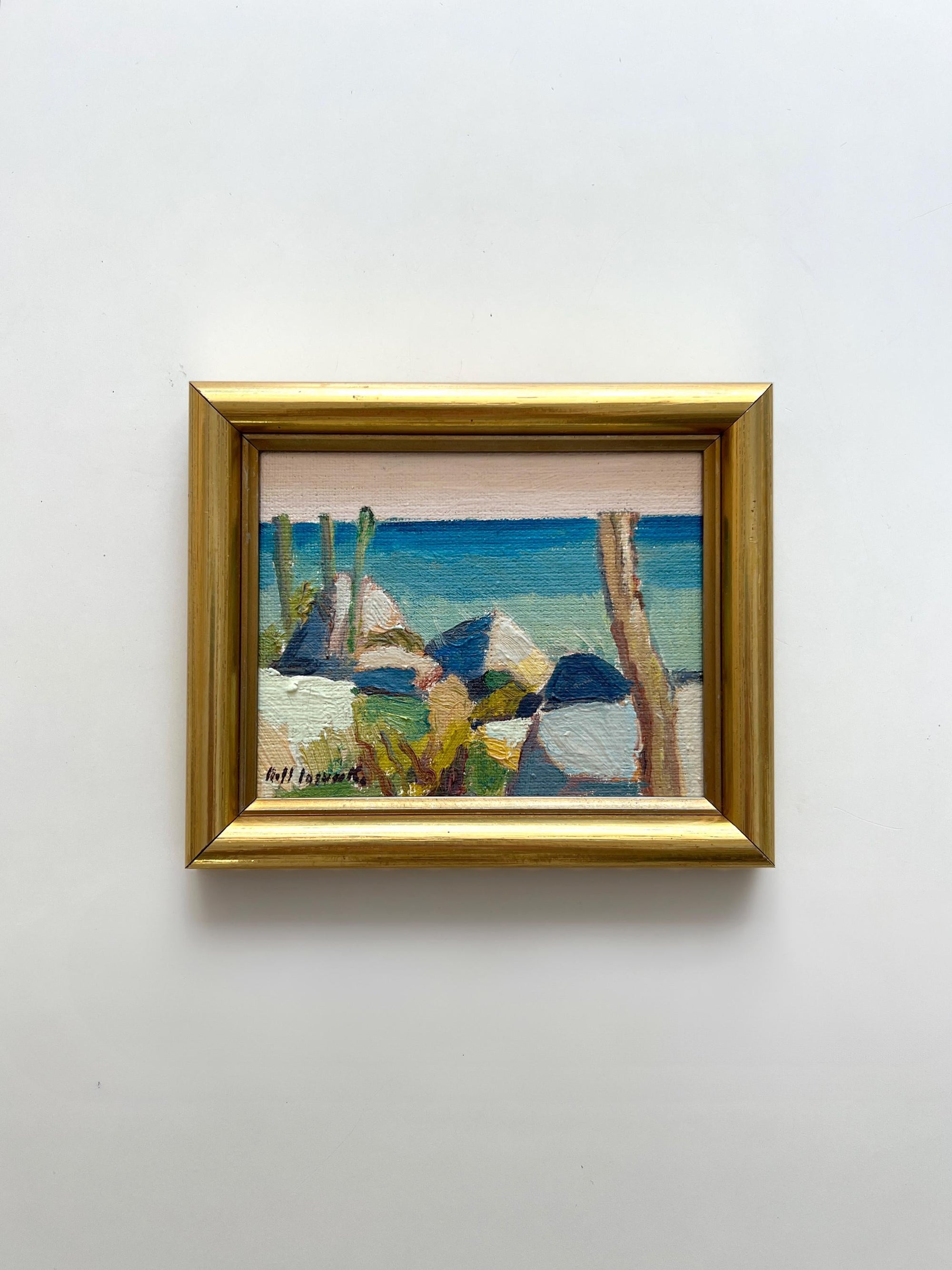 Framed vintage oil painting of a coastal scene with bright blue colours, available at Hue. 