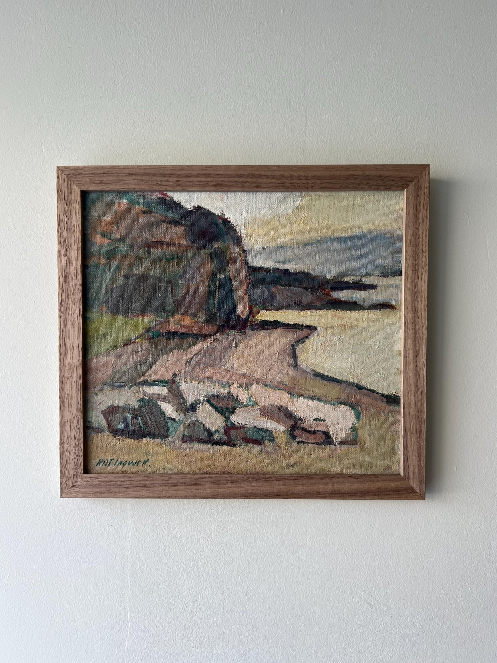Framed oil painting of a seascape in muted earthy tones framed in a solid walnut frame, available at Hue.
