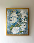 Framed vintage painting of white flowers on a blue background, available at Hue.