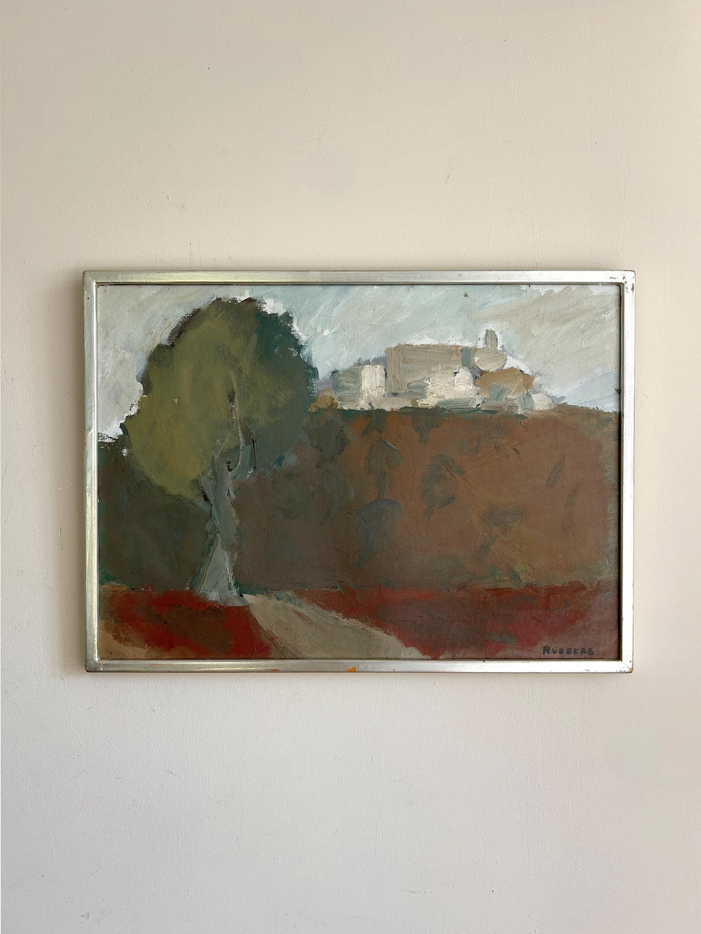 Framed vintage oi painting of a landscape with trees and buildings in a  slim silver vintage frame, available a Hue.
